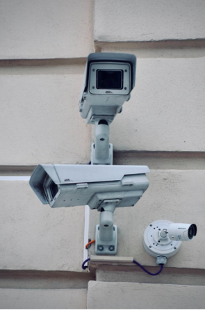 Picture of surveillance cameras. Photo by Arno Senoner on Unsplash